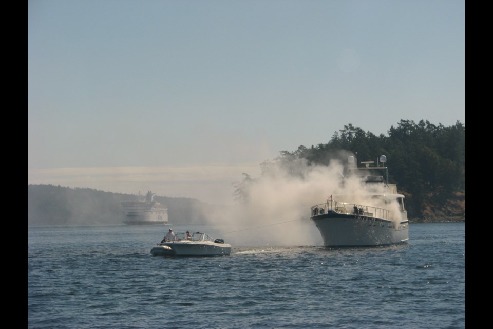 A 70-foot recreational boat registered in Seattle caught fire Wednesday morning near the Swartz Bay ferry terminal in North Saanich.