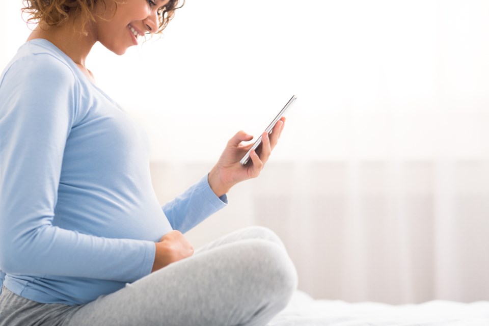 pregnant woman on phone