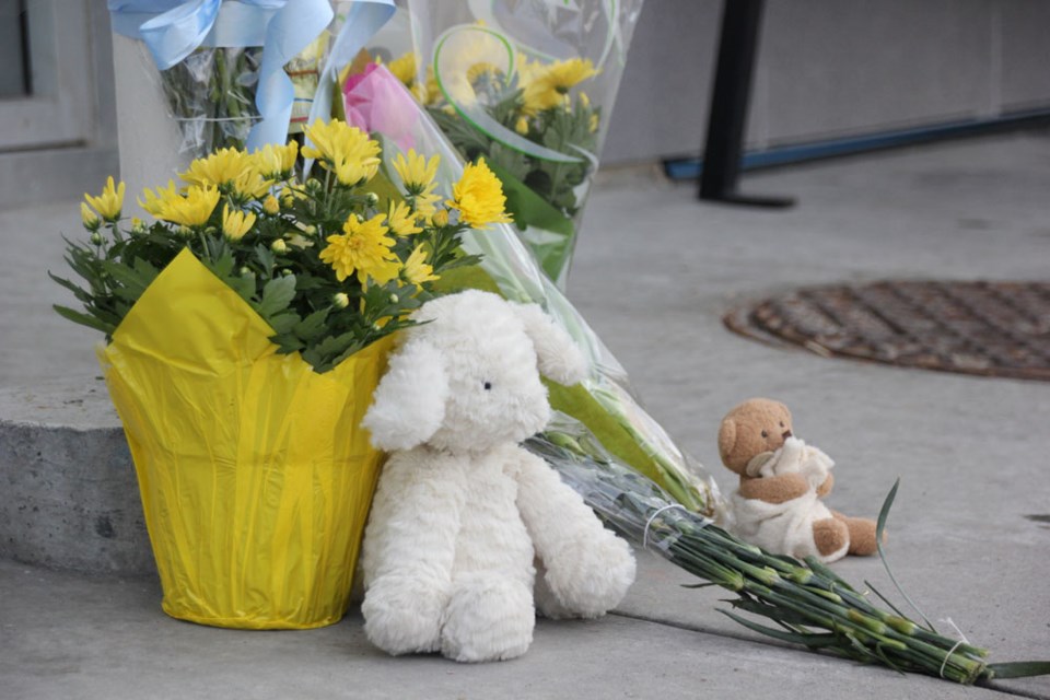 People have placed flowers, cards and toys in memory of the child who died after being hit by a car on Feb. 28.