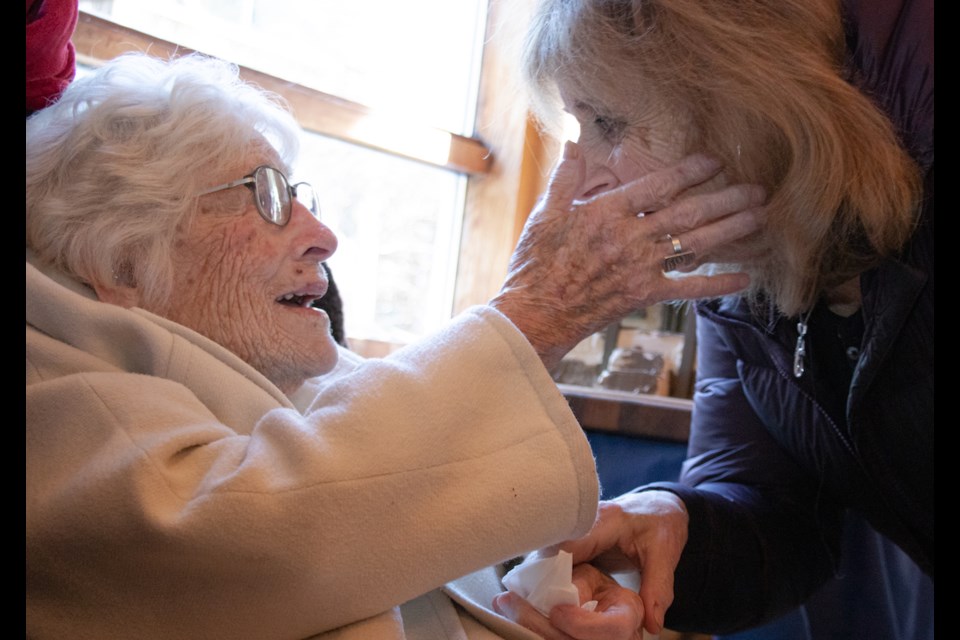 Jean Jamieson greets Sue Clarke at Jamieson's hundredth birthday party at Collins' Hall Feb. 9 (the actual day Jamieson turned 100).