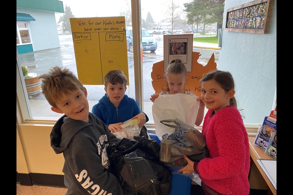 Frankie, Oliver, Alice and Elise with items collected during a recent recycling fundraiser.