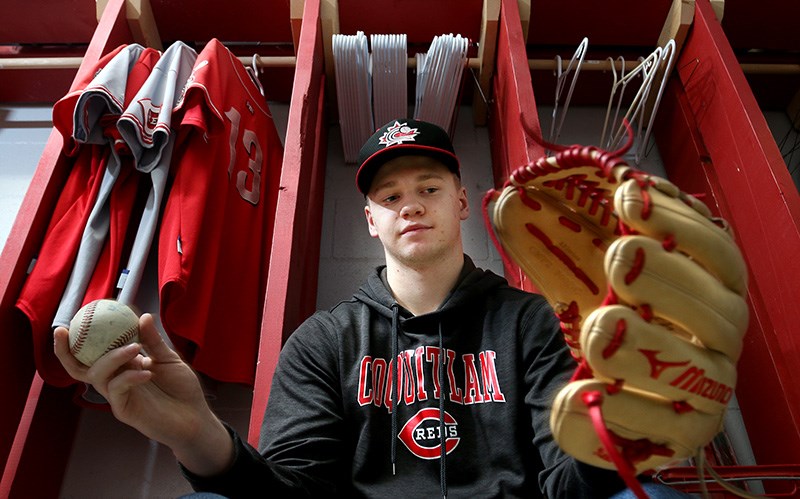 Coquitlam Reds pitcher Jack Seward works in a new glove as he prepares to head to Florida with Canada's junior national team to play a series of exhibition games against minor pro players and a split squad from the Toronto Blue Jays.