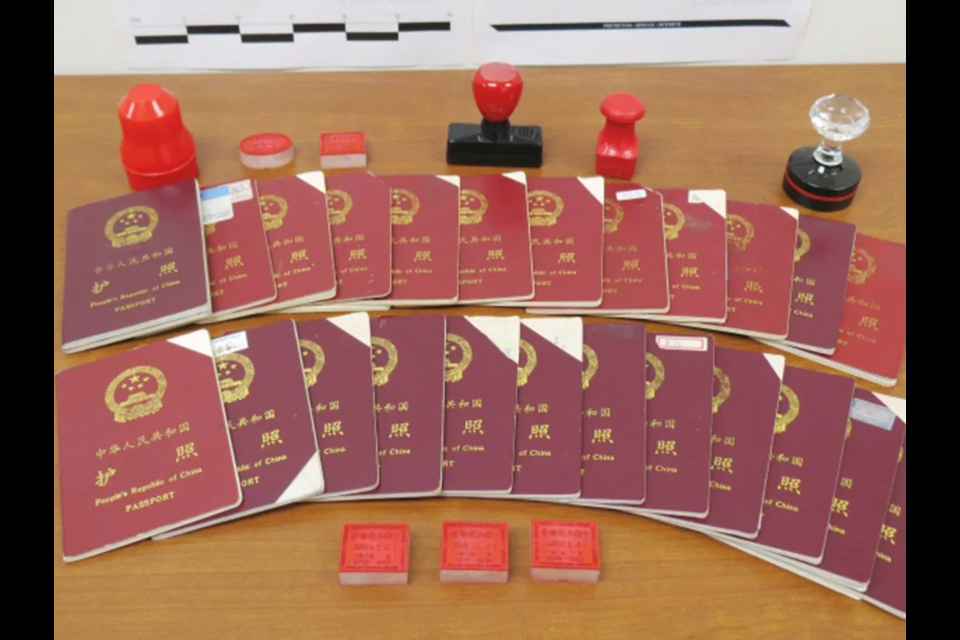 The CBSA displays seized passports and stamps used in a massive immigration scam by New Can Consulting. Li was one of 1,200 people who had her documents falsified with the company.