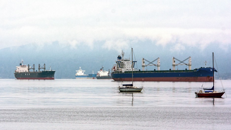 Cargo ships anchored in Burrard Inlet. COVID-19 sparked a major drop-off in global container trade.