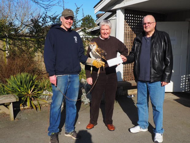 Rob Hope (left) of OWL receives a cheque from Port Community Liaison Committee members Dennis McJunkin (centre) and Mark Gordienko.