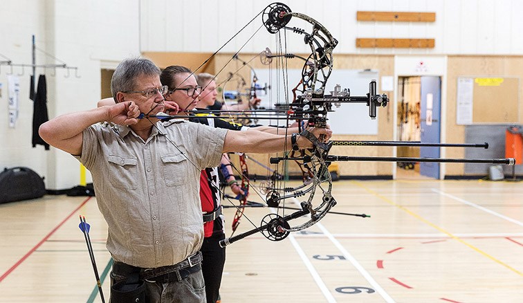 Citizen Photo by James Doyle. Archers take aim at their targets on Sunday afternoon at the Silvertip Archers indoor range while competing in the Archery Canada Regional Indoor Championships.
