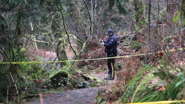 An RCMP officer on scene of a suspicious fire and death in Coquitlam's Minnekhada Regional Park