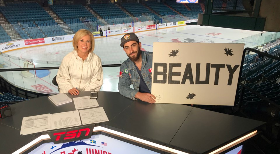 Jay Aikenhead and his signs are a fixture at Canucks games as well as the World Juniors.Photo courte