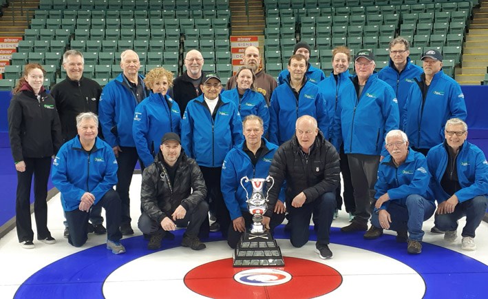 The ice crew for the World Women's Curling Championship gets together for one last group shot, posing with the trophy the teams would have been playing for had the March tournament at CN Centre not been cancelled do to the coronavirus pandemic. Curling returns to the Prince George Golf and Curling Club with the start of league play on Nov. 2.