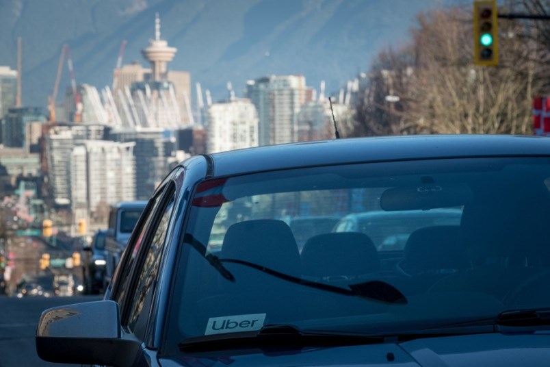 The Uber decal is seen with the Vancouver skyline in the background.