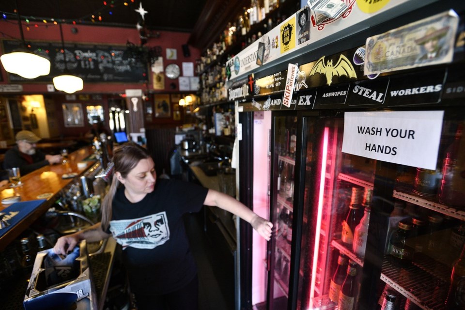 Bartender Aimee Braun worries COVID-19 might force businesses like The Brighton to close in the coming days or weeks — it’s one of her two service-industry jobs. Photo Jennifer Gauthier