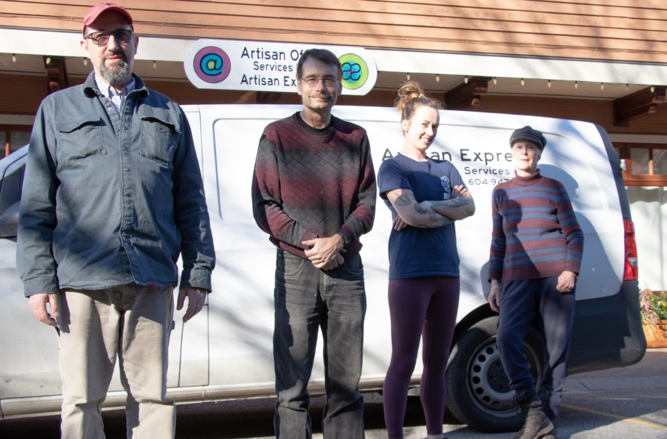 The couriers: four people standing in front of the Office van