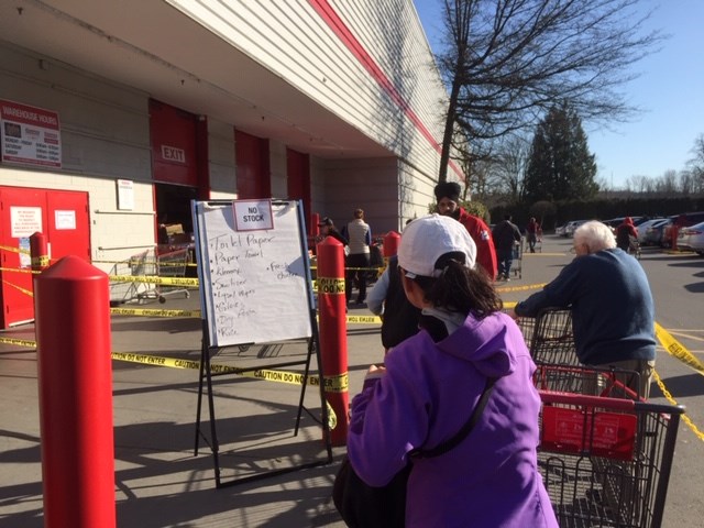 Long lineups at Costco where people are being allowed in only 50 shoppers at a time