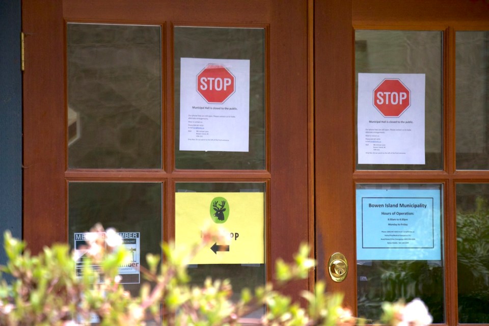 Door of Municipal hall with signs indicating that it's closed