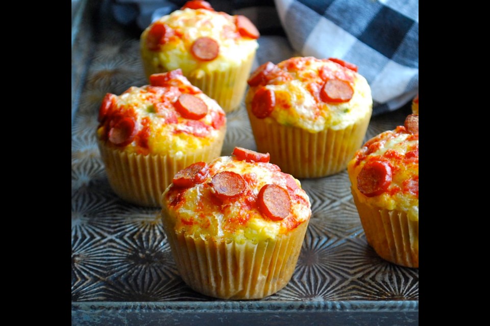 Savoury muffins offer a taste of pizza when topped with cheese and pepperoni.