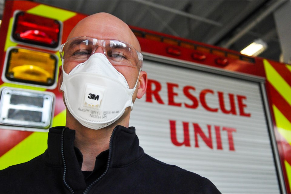 Port Moody firefighter Mark Wallbank demonstrates Level 1 personal protective equipment