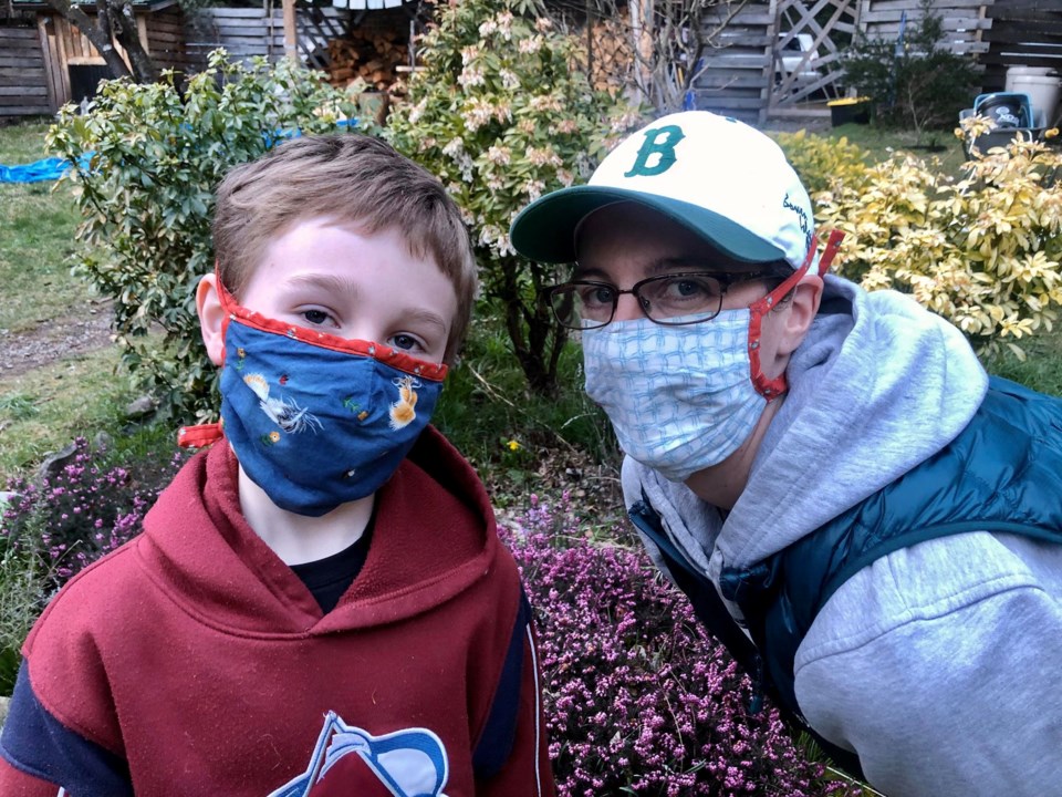 Boy and woman in homemade masks