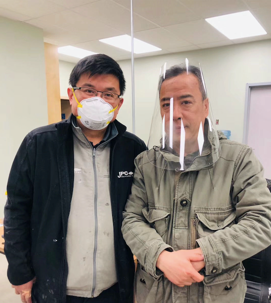 Jeff Jiang and Jin Ma (from left to right) were showcasing the face shields they made. Photo submitted