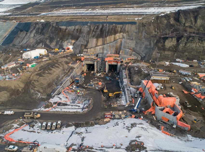 Aerial view of the diversion tunnel outlet portals and the temporary fish passage facility under construction at Site C, February 2020.