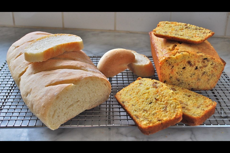 Rustic French-style bread (at left), and cornbread, the latter rich with herbs, cheese and onions.