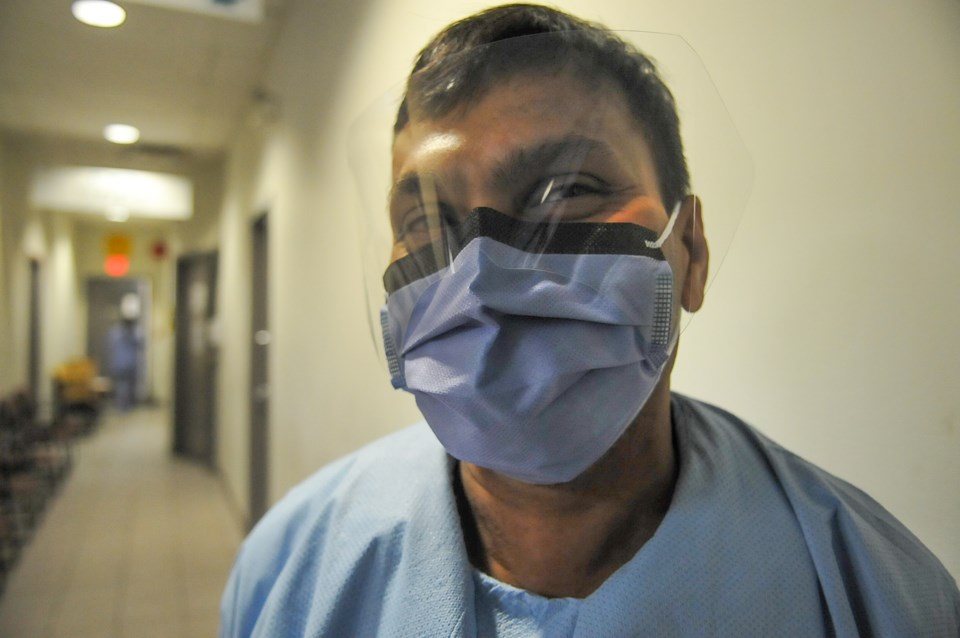 Naresh Thangarajah, 49, works 12-hour shifts disinfecting exam rooms at a COVID-19 testing clinic