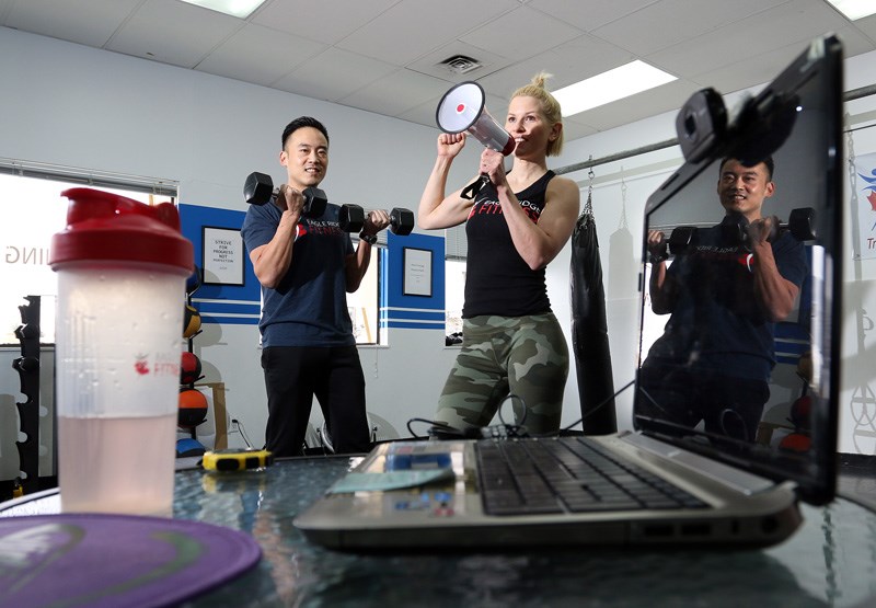 Sam Noh and his wife, Laurie Elizabeth, have all the tools and implements they need to lead a virtual workout challenge program to help support other local businesses in Port Coquitlam.