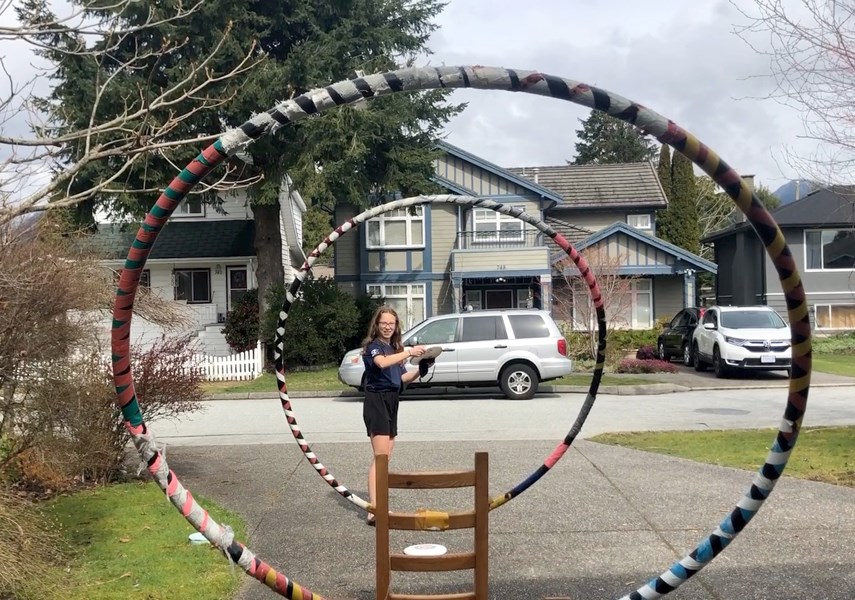 Sutherland's Hannah Smith sets up her trick shot in the finals of the Isolympic Games, a friendly online competition that brought together high school ultimate teams from across B.C. photo screenshot Danie Proby