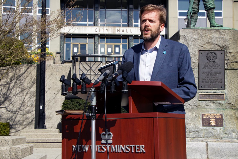 New Westminster Mayor Jonathan Cote speaks in front of city hall on Monday morning on behalf of TransLink, which is seeking emergency funding from the provincial and federal governments. Cote is chair of the Mayors Council on Regional Transportation.