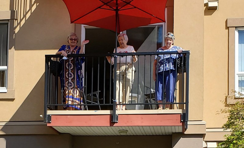 Thankful seniors express gratitude outside the Astoria Retirement Residence in Port Coquitlam.