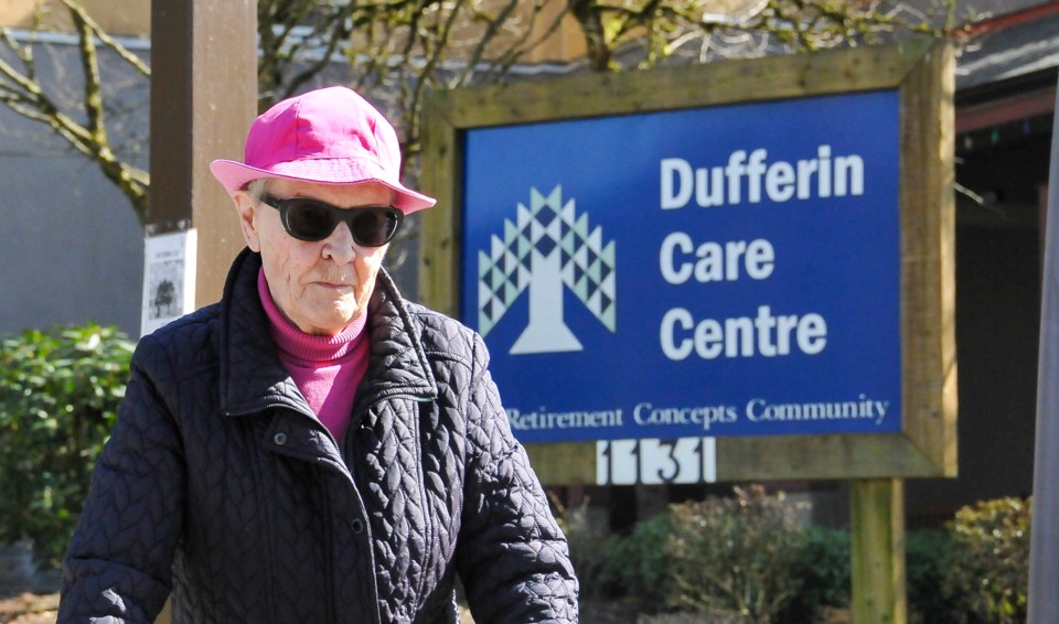 A resident of a nearby seniors home passes in front of the Dufferin Care Centre the day the facility