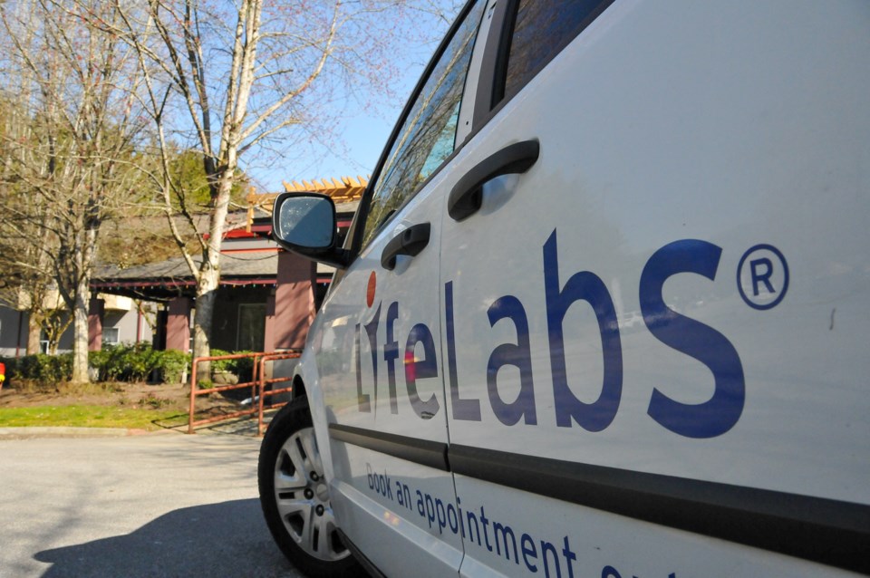 A Life Labs employee comes to pick up test samples at the Dufferin Care Centre March 20, the day Fra