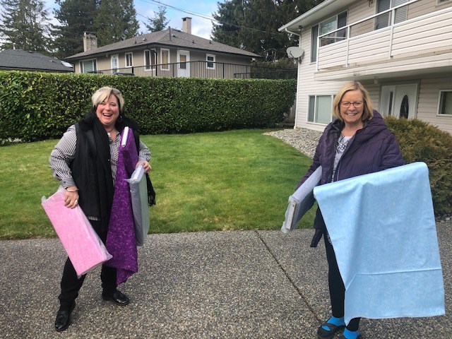 Cindy Paddington, left, and Darlene McCann of the Soroptimist International of the Tri-Cities, with some of the fabric used to Dress the Docs in the Tri-Cities. Volunteers are making gowns for local family physicians.