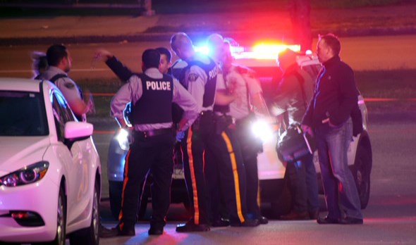 Police investigate a stabbing in the 3700 block of Venables Street, just inside the Burnaby border, last night.