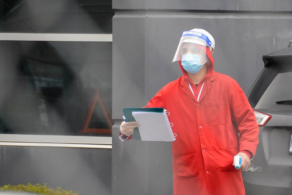 An employee at Superior Poultry greets a team from Fraser Health.