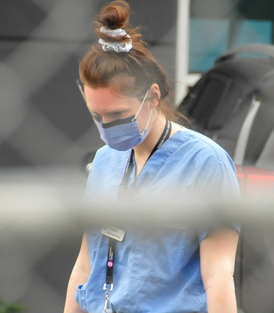 A nurse from Fraser Health outside Superior Poultry Processors Ltd. Thursday, April 23. A worker tol