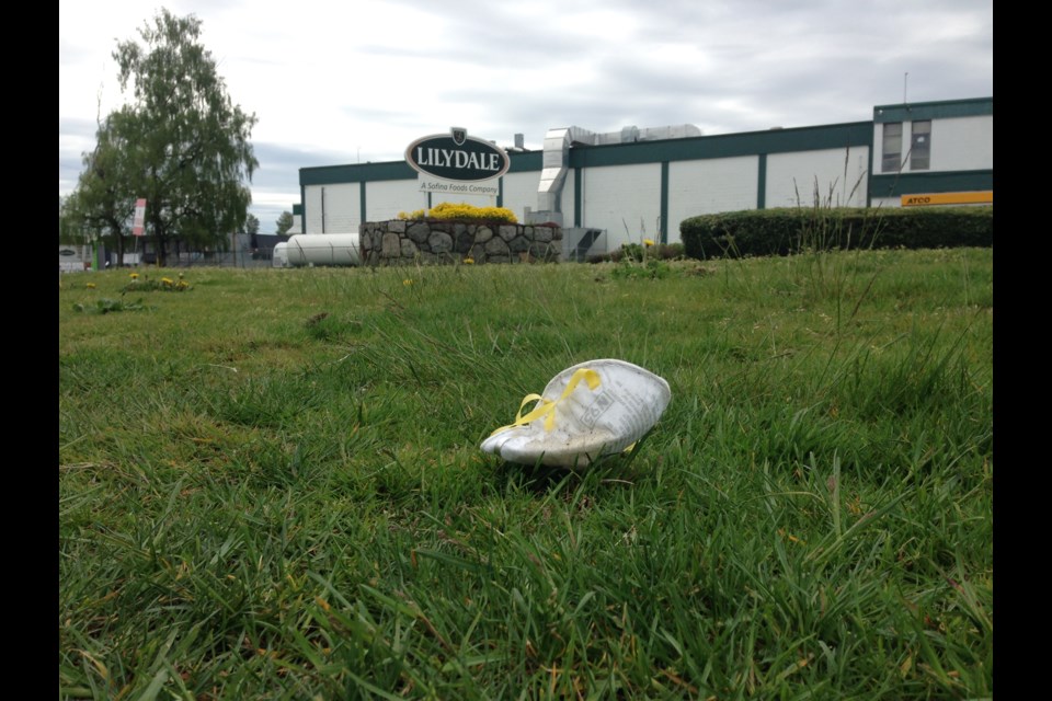 A medical mask discarded outside the Lilydale poultry processing plant run by Sofina Foods Inc. One worker and a family member were revealed to have tested positive for COVID-19 Wednesday, April 29.