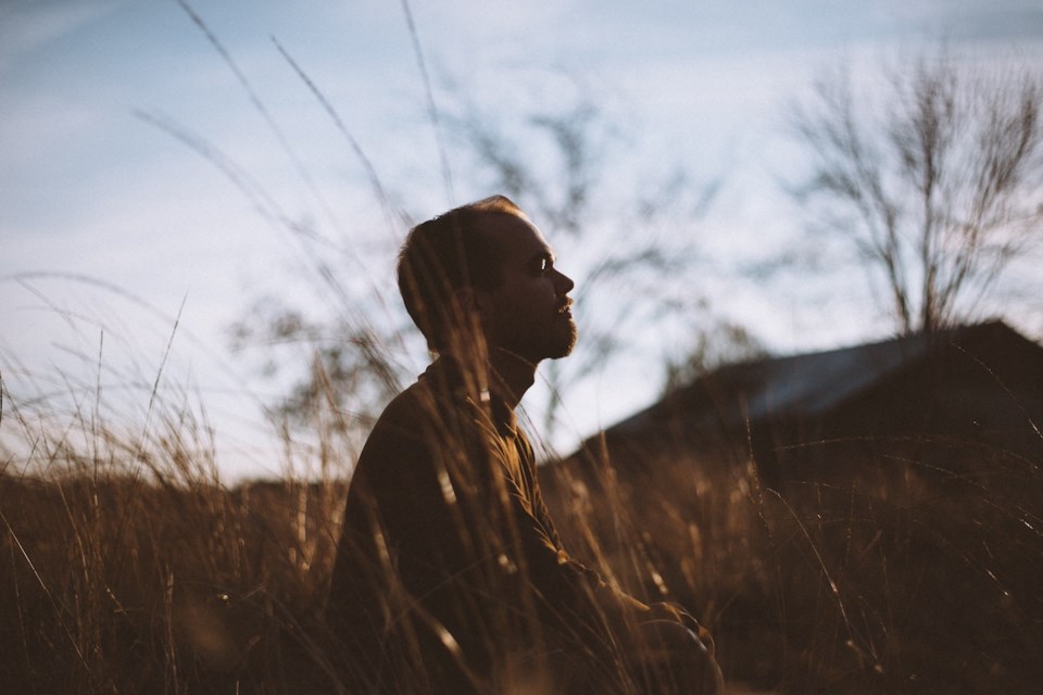 Man sitting in grass