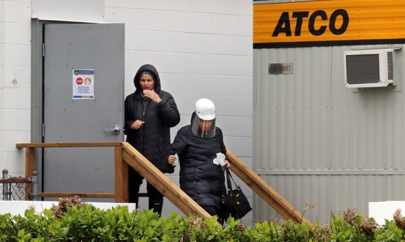 Workers leave Lilydale chicken processing plant in Port Coquitlam for their lunch break on Wednesday. Photograph By MARIO BARTEL/THE TRI-CITY NEWS