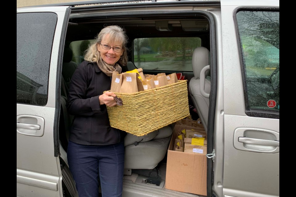 Eileen Buhr, teacher librarian at Jessie Wowk, out delivering the special package to the 220 students. Photos submitted