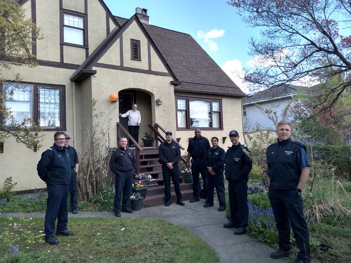 Burnaby firefighters with Burnaby resident Pamela Tessaro, who turned 100 recently. Photo submitted