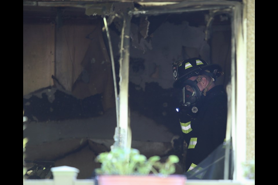 Victoria fire inspectors comb though the blackened interior of a home in the Oaklands neighbourhood. May 4, 2020