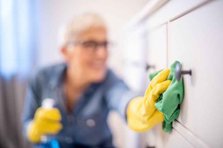 Woman cleans home