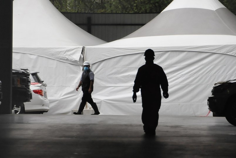 Employees at Superior Poultry Processing Ltd. the day a Fraser Health SWAT team entered the facility