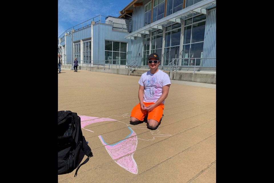 Darren Long spent Saturday creating bright, cheerful chalk drawings along Steveston boardwalk to help lift people's spirits amid the COVID-19 pandemic.