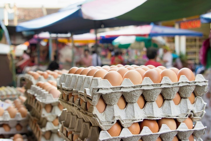 Chicken Egg Vendor with Stacks of Eggs at Southeast Asia Wet Market.