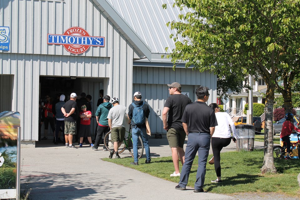 Line-up of people at Garry Point Park over Victoria Day long weekend.