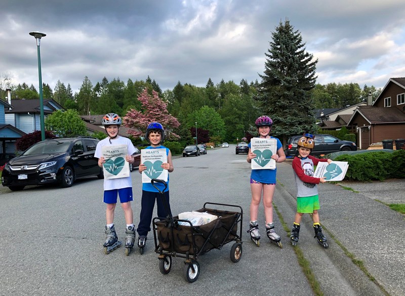 The four Aubertin siblings roller-delivering the newspapers on Thursday