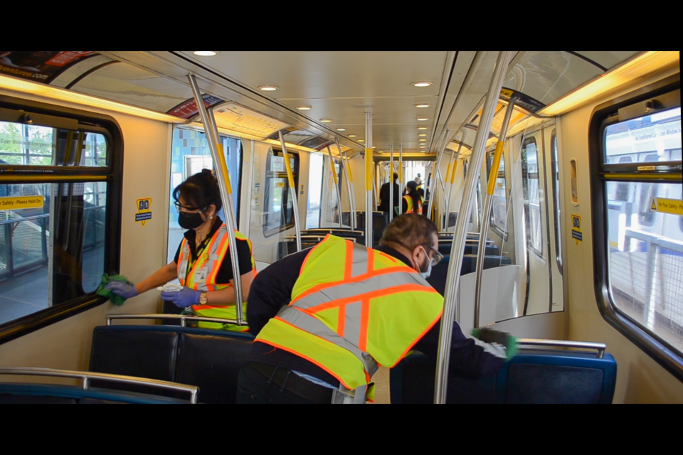 TransLink says a cleaning "pit crew" (pictured) will be on hand at busy stations to sanitize train cars and high-touch surfaces as service levels and ridership ramp up as B.C. reopens. It's one of the new measures, along with asking riders to wear face masks, announced by TransLink Thursday.