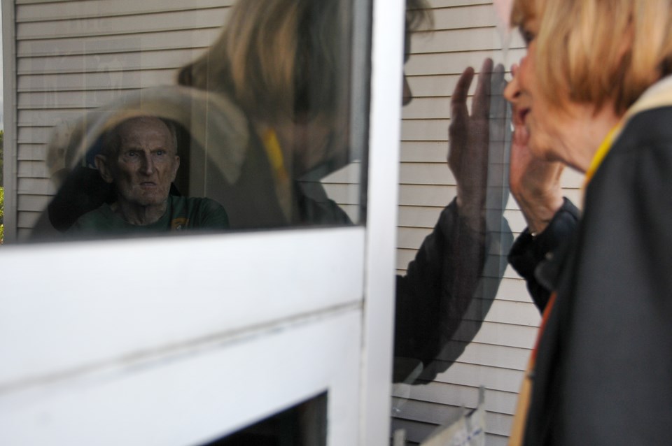 Brigitte and Bernie celebrated their 61st anniversary through the sealed window due to a public heal