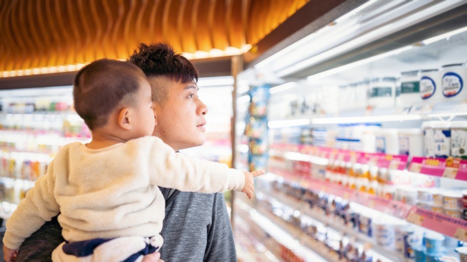 A man goes shopping with his kid.